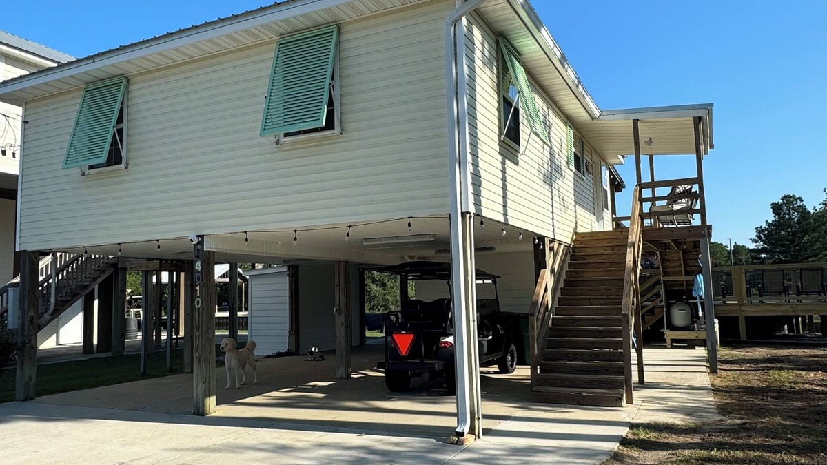 Shoreline Park House | Wine’d Down-Charming 2 BR/2BA on the water with a pool & dock in Bay St Louis