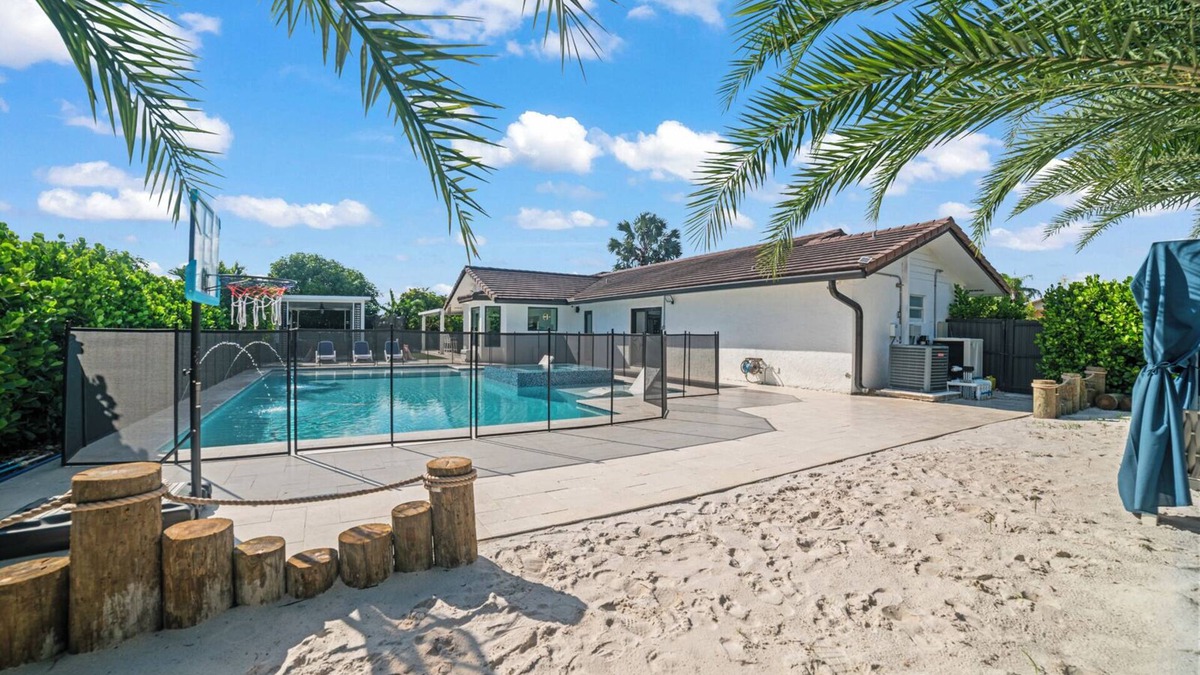 Ludlam Resort | You'll be captivated by the stunning 28 x 40 custom heated pool with jacuzzi