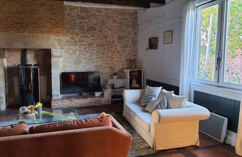 Moulinet House | 15th century house with swimming pool in the middle of orchards