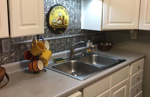 East of Broadway Cottage | 1882 Carriage House In The Heart Of The City!