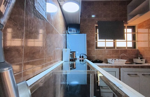 Prampram Apartment | 2-bedroom apartment in Accra with fitness room, WiFi, AC with a balcony views
