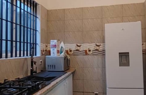 Lome House | 2 Bedroom Furnished Living Room, Air-conditioned Legbassito Loménnn