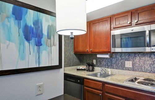 Lexington Hotel | 2 Convenient Suites Near Airport | Free Parking | Seasonal Pool | Kitchen