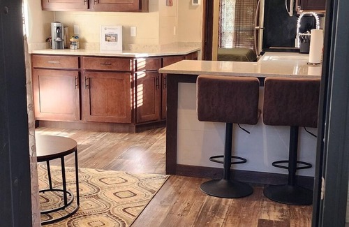 Mill Spring House | 2-story creek side tiny home, dog-friendly, screened in porch, quick walk to pool and playground, sleeps 6.