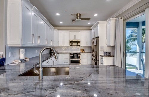 Mid Island House | 251 Key West Court: HUGE Luxe Beachfront Pool Home Steps from the Sand