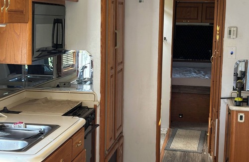 McMillan House | 38 ft Holiday Rambler RV with full hookups electric wifi everything you need.