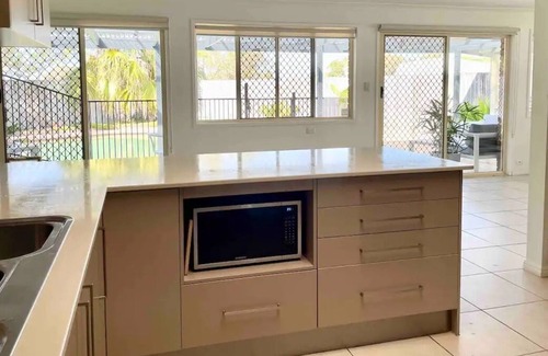 Runaway Bay House | 4 BR Home in Runaway Bay Close to Sports Complex