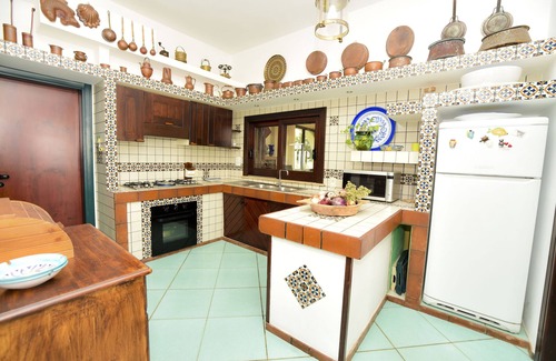 Porto Palo Villa | A balcony on the beach, pool, lush park