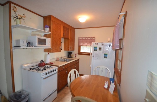 Maple City House | A beautiful resort cottage on Big Glen Lake with a tennis court and kayaks