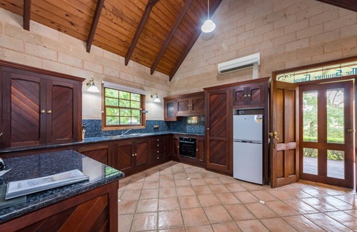 Possum Brush House | A beautiful split level sandstone and cedar cottage.