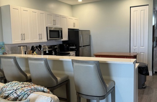 Treasure Cay Condo | A beautiful white sand beach, an inviting pool and lush grounds.