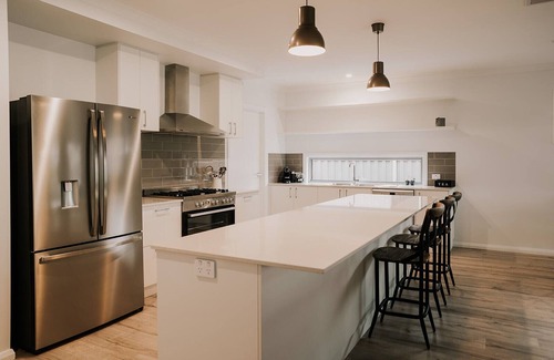 Yarrawonga House | A Brand New Home with a Pool overlooking The Black Bull Golf Course