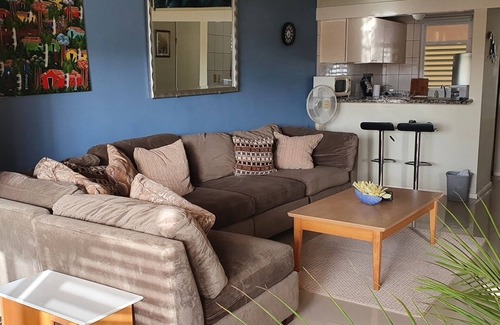 Santa Rosa Condo | A small mansion with a large swimming pool in a botanical garden