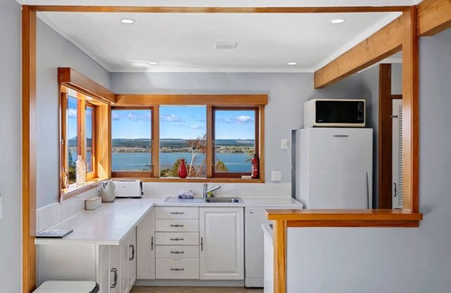 Acacia Bay House | Acacia Bay Retreat | Stylish Family Getaway with Fireplace & Lake Views