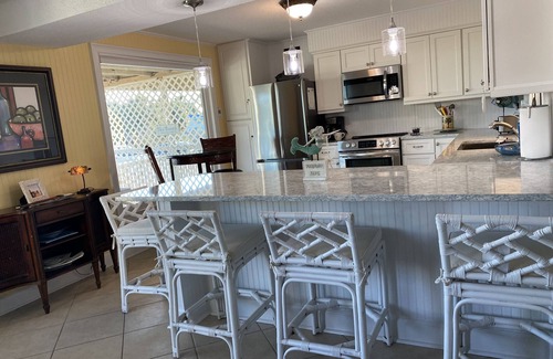 East End Condo | Adorable Beach Cottage. Full size swimming pool shared by four units in building