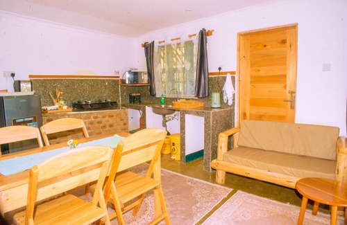 Iringa Apartment | Aika Sunrise: Treetops Apartment