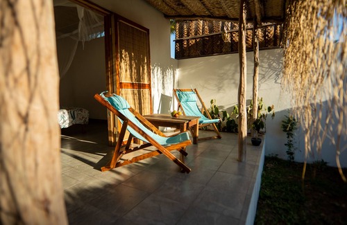 Tofo Apartment | Air conditioned en suites with King size beds and mini fridges with verhanda