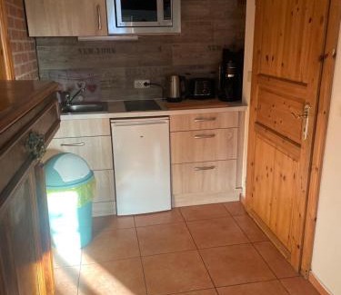 Hemmoor Apartment | Altes Landhaus Oste, Klavier Appartement, 2 Zimmer mit Kamin
