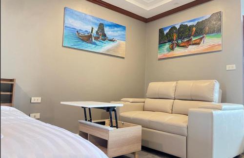 Patong Apartment | Andaman Sea Apartments near Patong Beach - 28 SQM with Kitchen, Private Bathroom, Seating Area, 65" Smart TV with Free WIFI