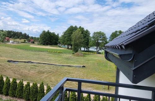 Faszcze Apartment | APARTAMENTY SKORUPKI-Mazury Mikołajki