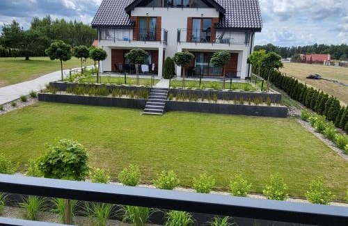 Faszcze Apartment | APARTAMENTY SKORUPKI-Mazury Mikołajki
