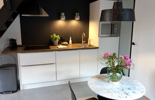 Heerlen Apartment | Apartment for two people in renovated former primary school with lovely garden.