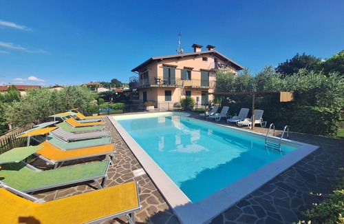 Manerba del Garda Apartment | Apartment with swimming pool and soccer field parking lot with gate
