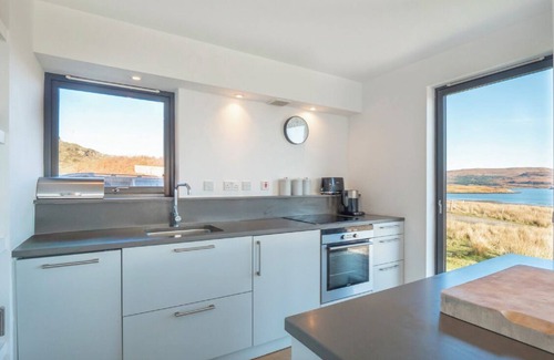 Skinidin House | Architect designed eco house with stunning loch and Mountain Views