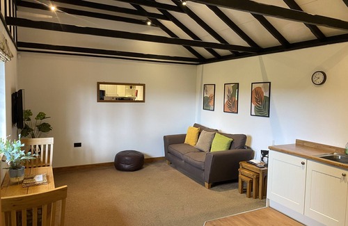Runnymede Cabin | Ash lodge sleeps two people in a peaceful, private setting.