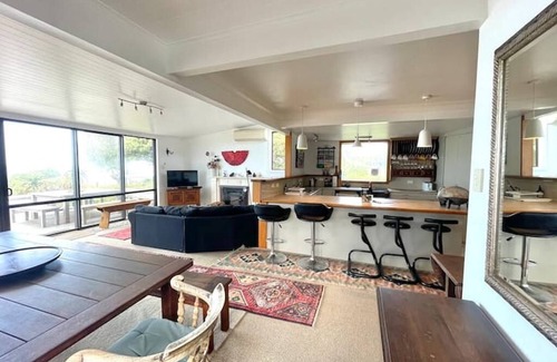 Wainui House | Awesome Wainui Spacious Holiday Home Overlooking the Surf - no pets.