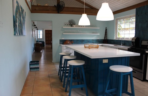 Runaway Bay Villa | Baywatch - seaside villa, modern, spectacular location & garden, pool, cook