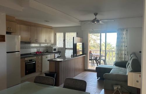 Platja de Piles Apartment | Beautiful apartment Lilou in 1st line sea view, swimming pool and palm trees