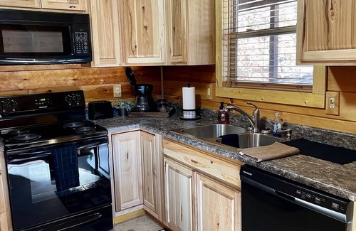Louisa Cabin | Beautiful cabin with fireplace and wrap around porch and private upstair balcony