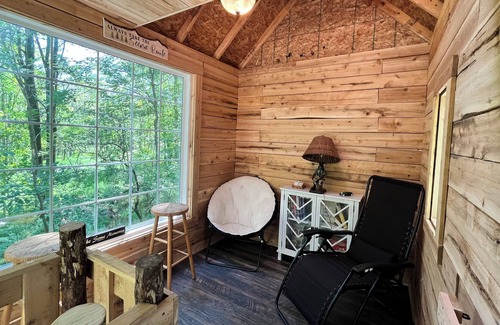 Kent County Cabin | Beautiful cedar treehouse that has wall-to-wall windows, forest and river view!