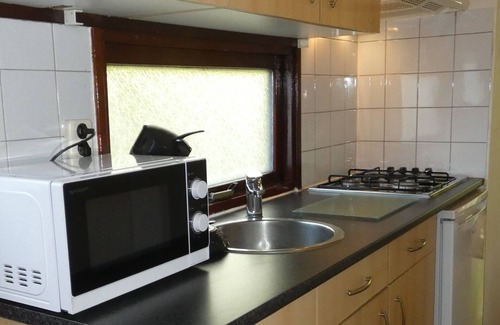 Marum Ski Chalet | Beautiful chalet for rent overlooking ornamental pond against forest + parking lot