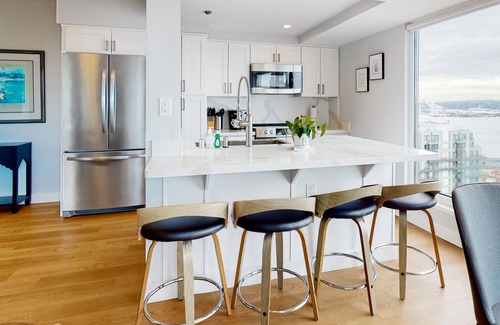Downtown Seattle Condo | Beautiful water view condo with full kitchen, fitness area, & W/D
