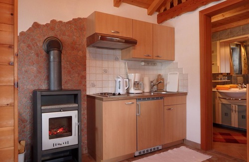 Fendels Apartment | Beautiful wooden hut with a cozy fireplace, stone pine parlor and stone pine bed
