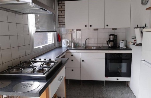 Sint Maartensvlotbrug House | Belkmerduinen 23 is in aquiet location surrounded by greenery and trees.