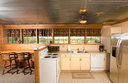 Sand Springs Cabin | Blufftop cabin with private patio and gorgeous views! Daily country breakfast included.