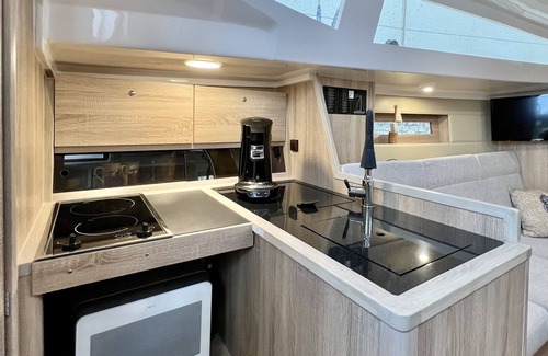 Ostholstein Boat Rental | Boat 'Hausboot Segelyacht Nui' on the sea and Private Terrace