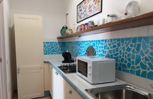 Santa Reparata Apartment | Bright one-bedroom apartment with sea view a few steps from the beach