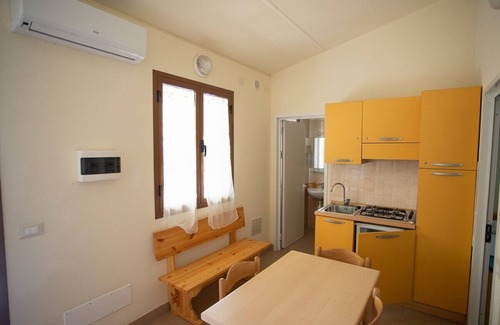 Ex Campo d'Aviazione House | Bungalow in masonry in the campsite