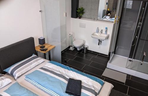 Heimsheim Hotel | BUSINESS-MOTEL with SmartTV, 20min massage, air-con, XXL-Parking, eCharging, Video-Security