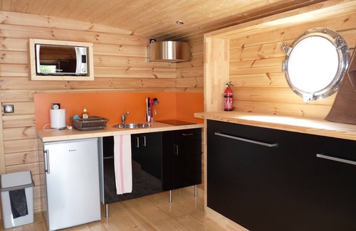 Chassenard Boat Rental | Cabin dinghy at anchor