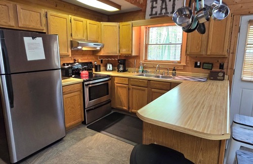 Swanton Cabin | Camp Valentine- charming 3 bedroom cabin with hot tub and fireplace in private setting
