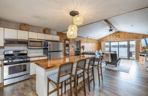 Canadian Lakes House | Canadian Lakes, Michigan beach home on private lakenn