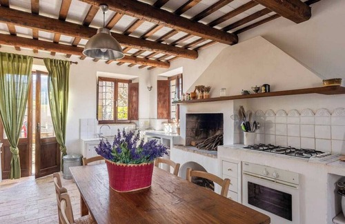 Santa Vittoria in Matenano Villa | Casale Oliva in a landscape of oaks, olives and cherry trees.