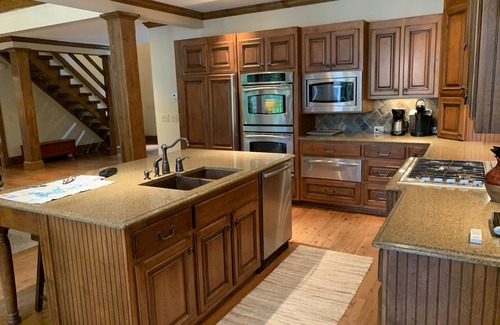 Henderson House | Celebrate Spring! Beautiful, custom Kerr Lake lodge home + private dock.