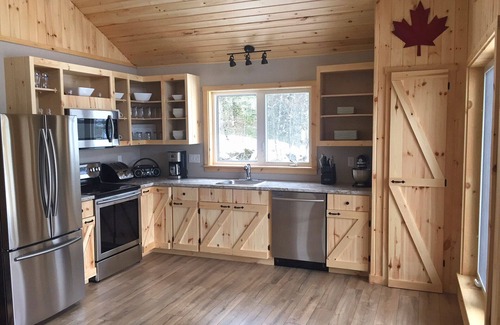 Queens House | Chalet directly on the lake, central storage, incl. access to private island