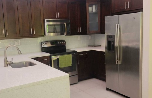 Sunset House | Charming 2-bedroom, 2-bath townhome in the vibrant Dadeland area of Miami.n